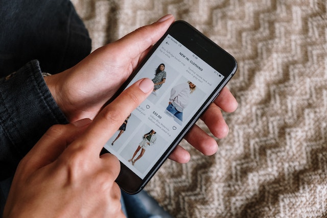 A shopper is using the TEMU app on their phone